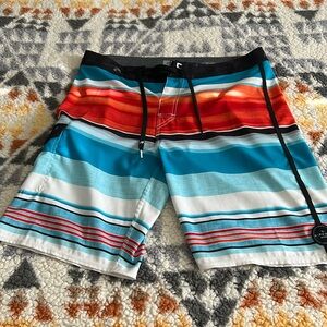 Ripcurl size 32” waist Men’s board shorts. Black, blue, white, red, and orange.